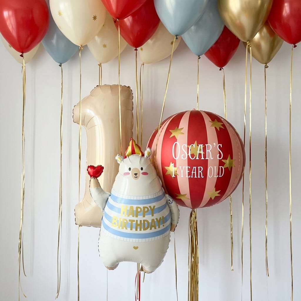 Personalized first birthday balloon set with a number one and a name balloon