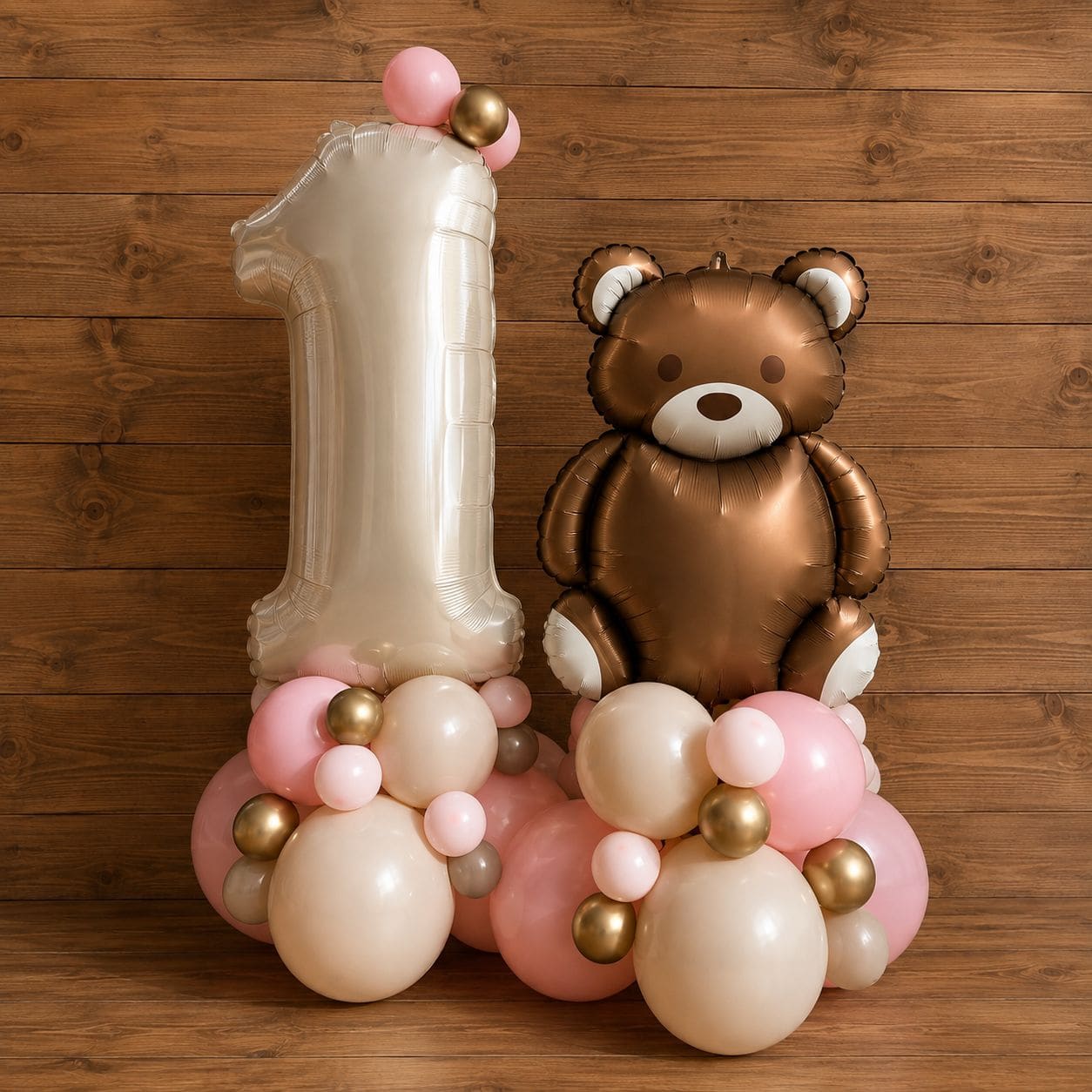 Large number one balloon with a teddy bear balloon on a balloon cluster base
