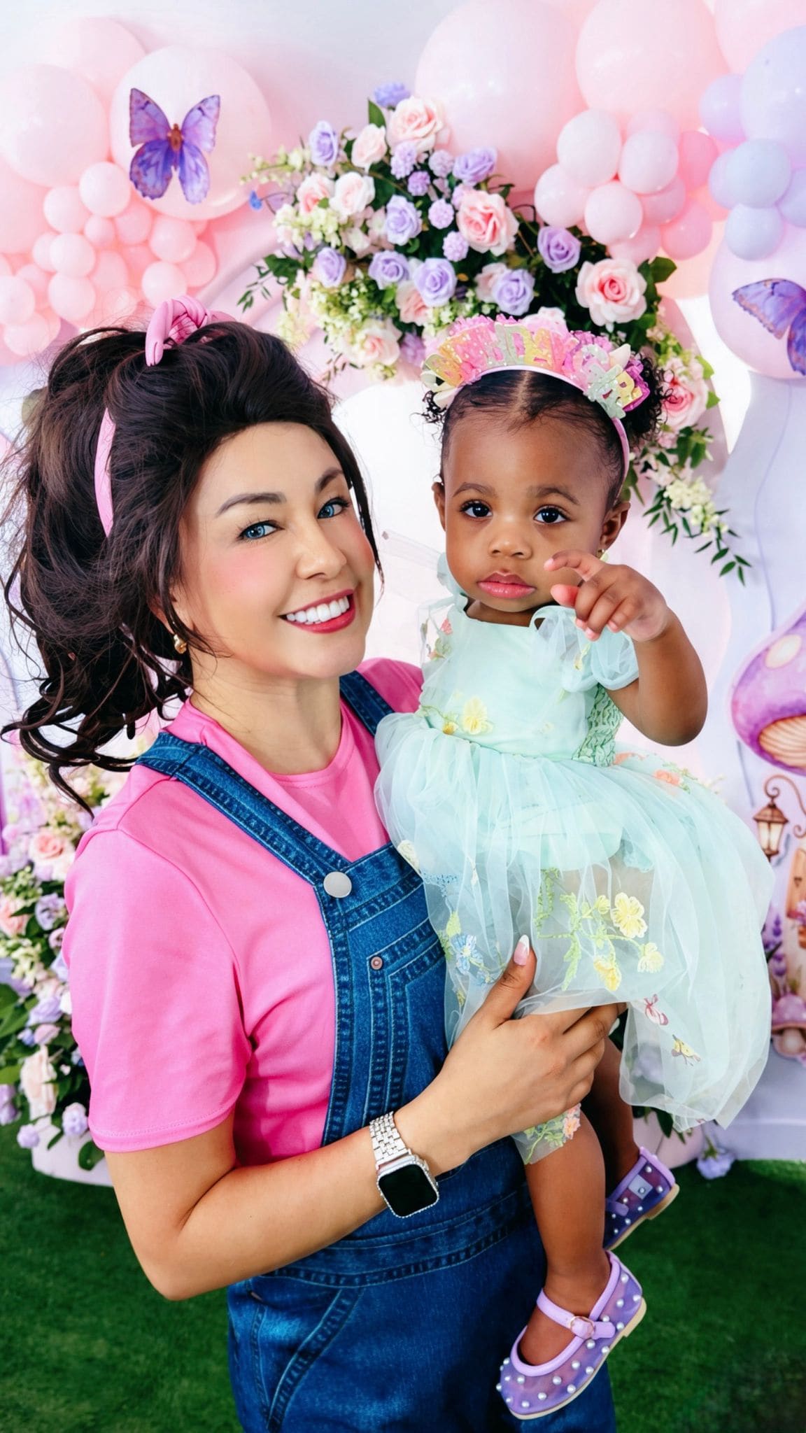 Costumed character performer with a child at a birthday party